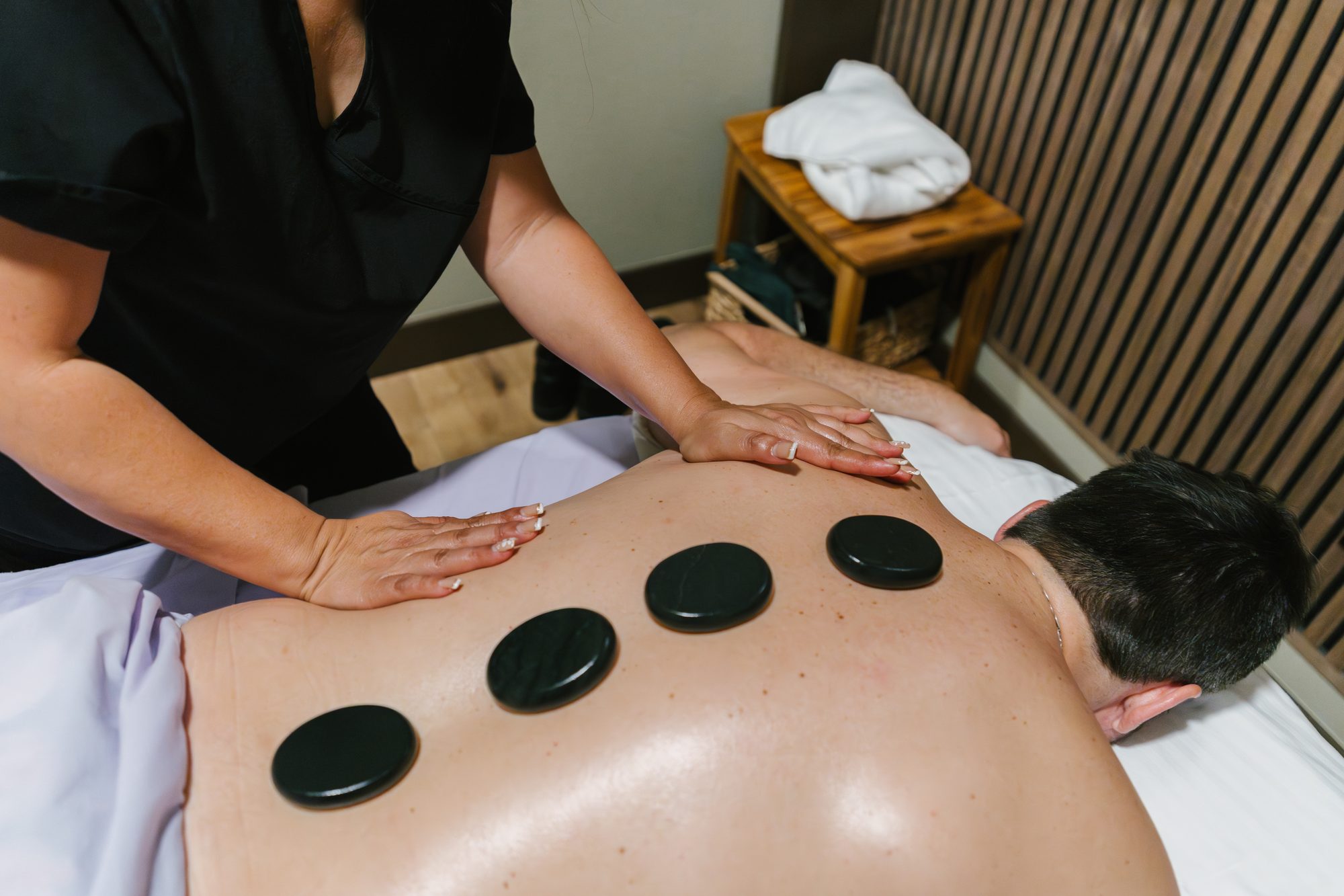 Warm stone massage therapy